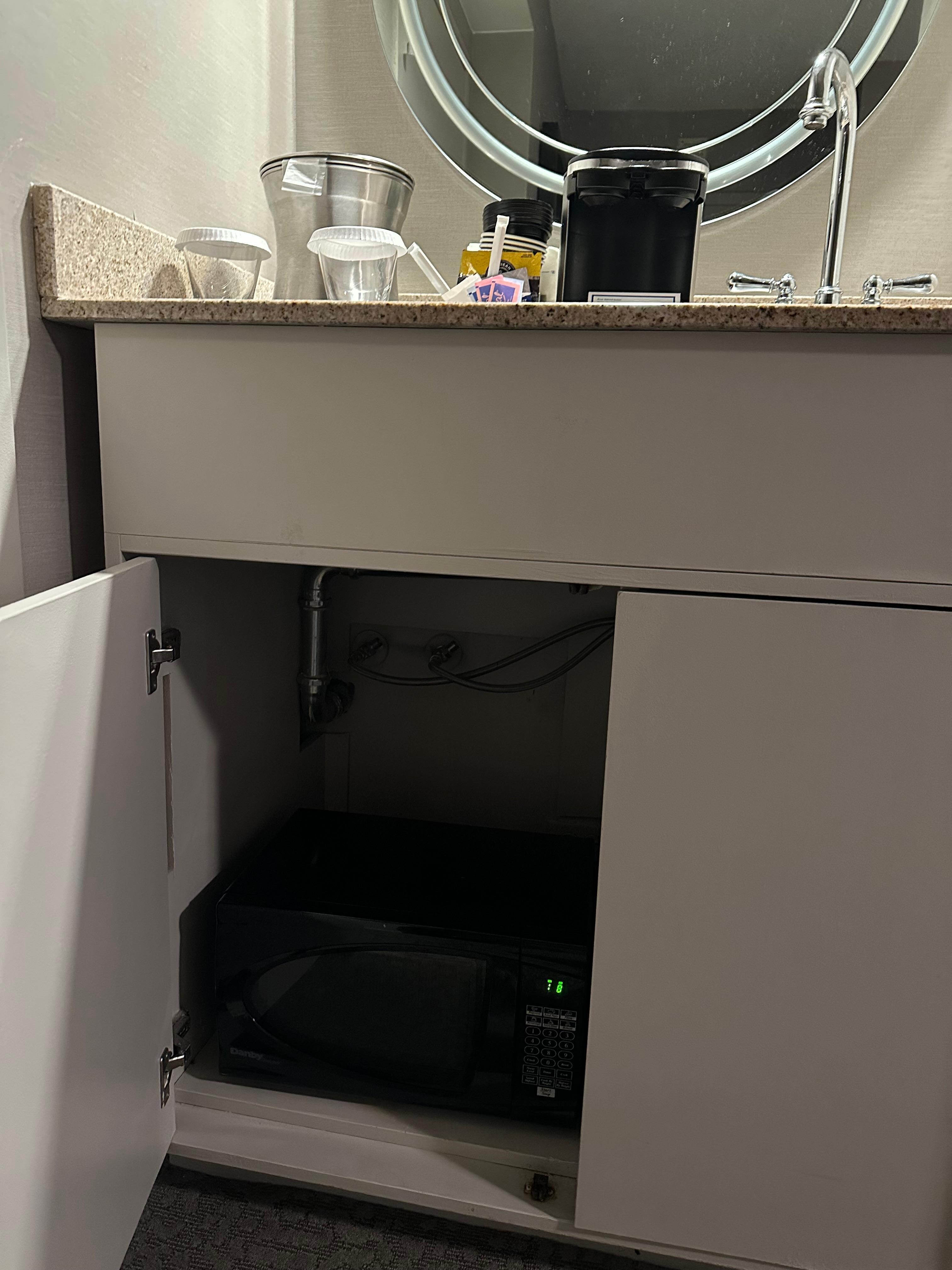 Working Microwave in bottom cabinet w broken door 