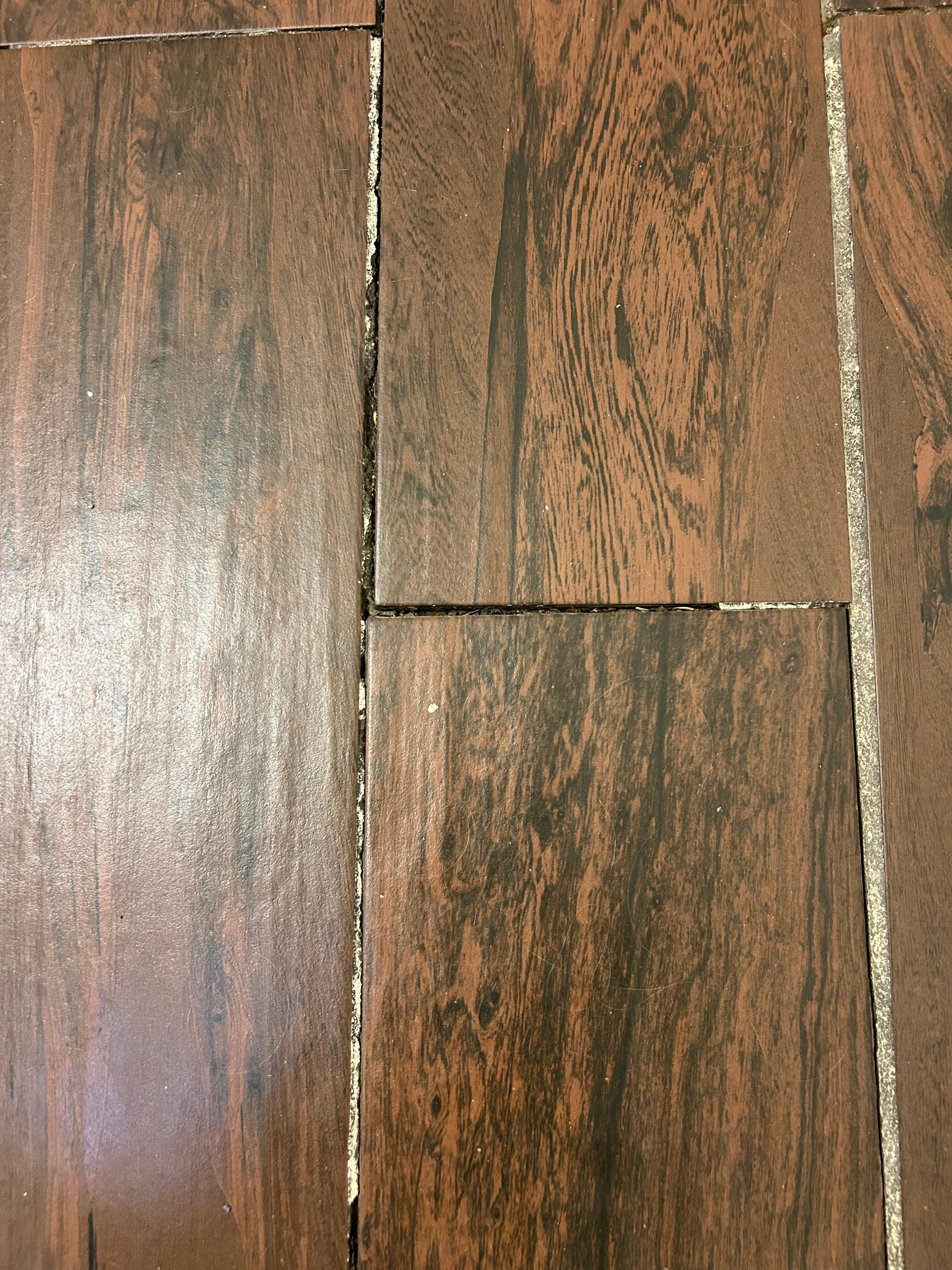 The grout was missing so when you stepped just so, the tile moved!