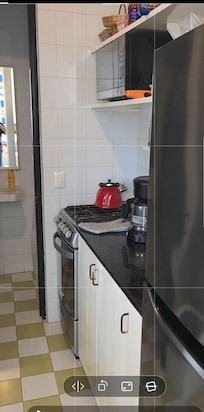 Upstairs kitchen w/ full bathroom at back