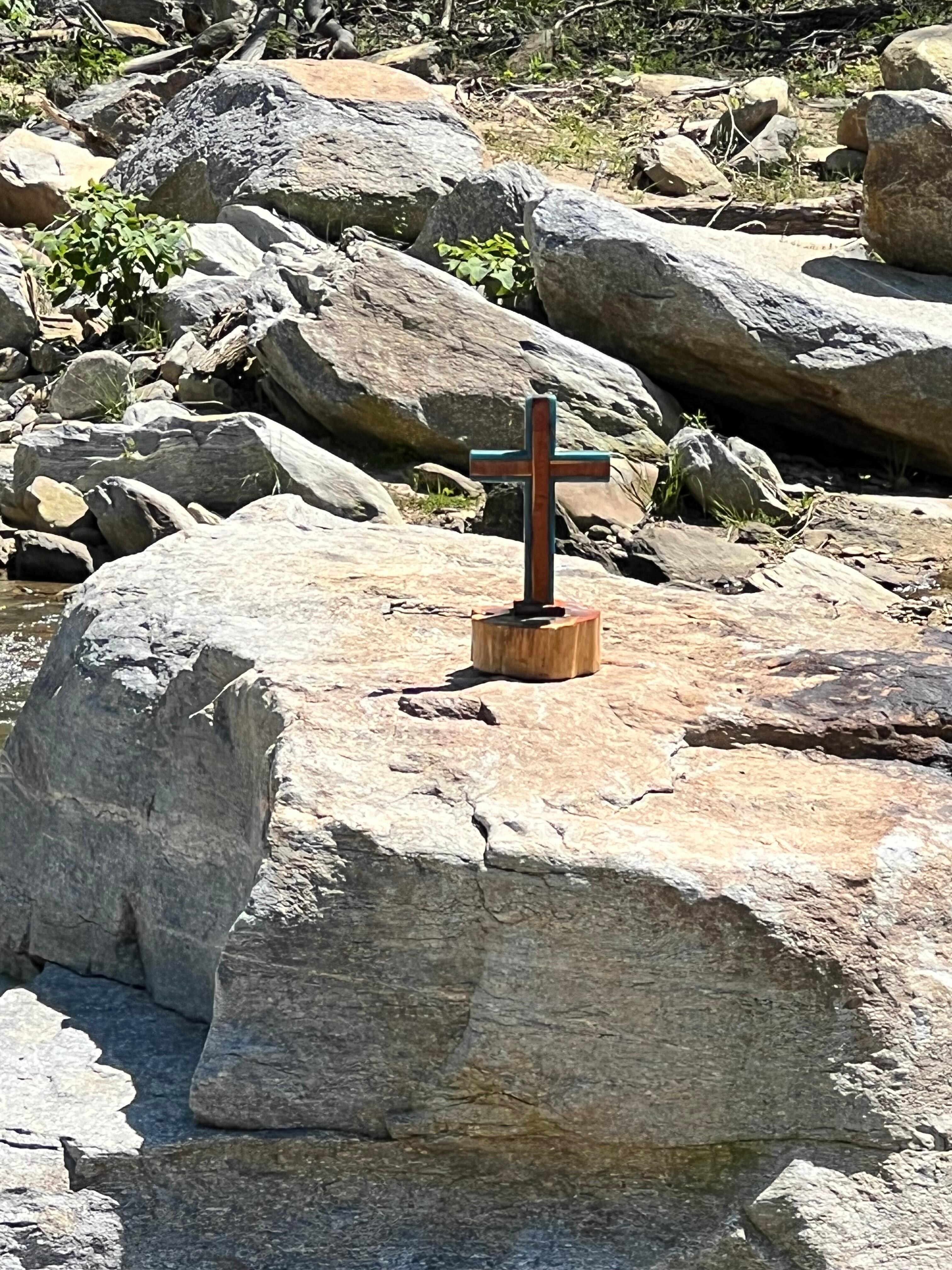 We spotted this cross  in the riverbed at Chimney Rock........Powerful!