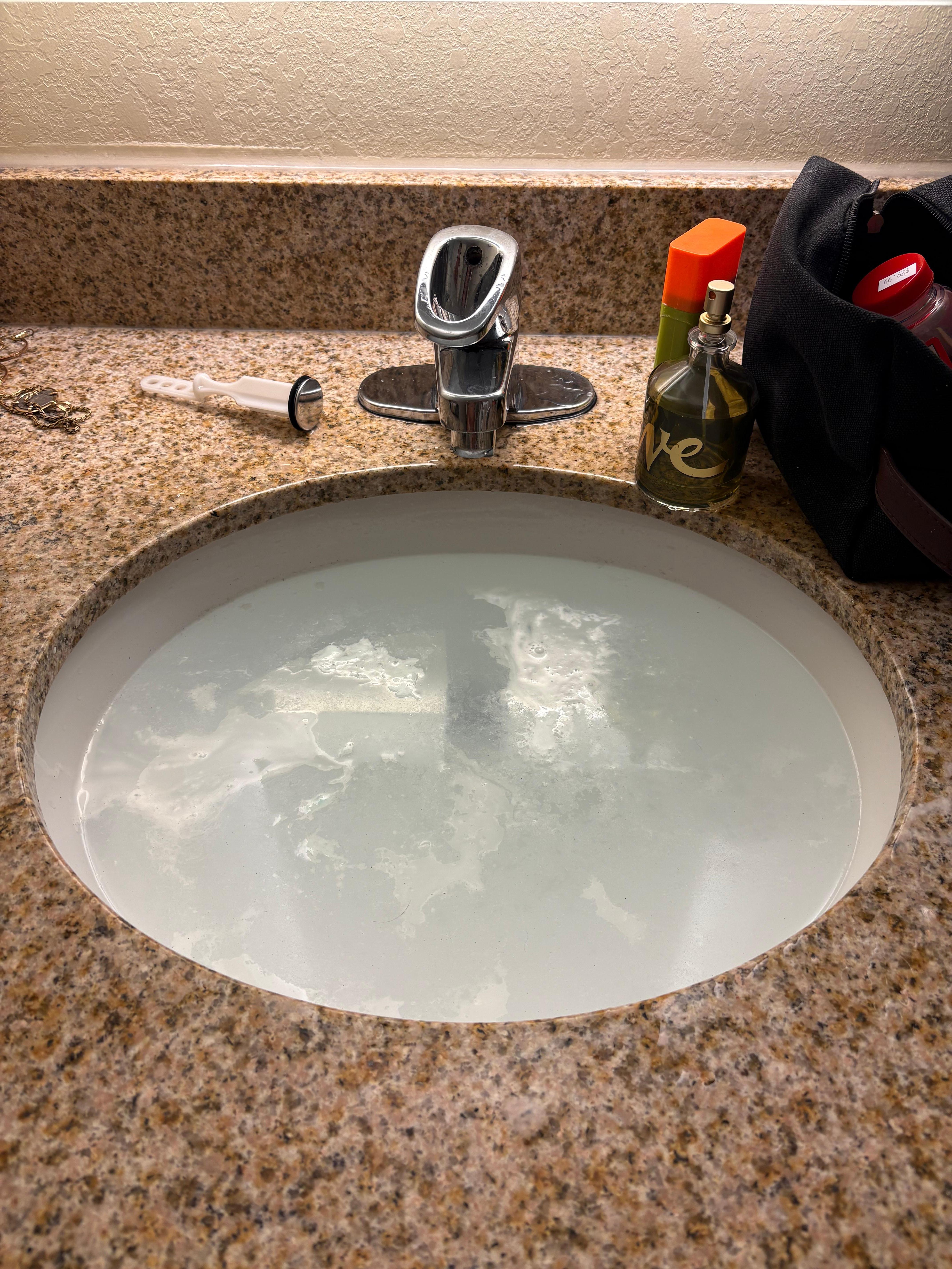 Sink stopped up, under sink leaked into bathroom floor.