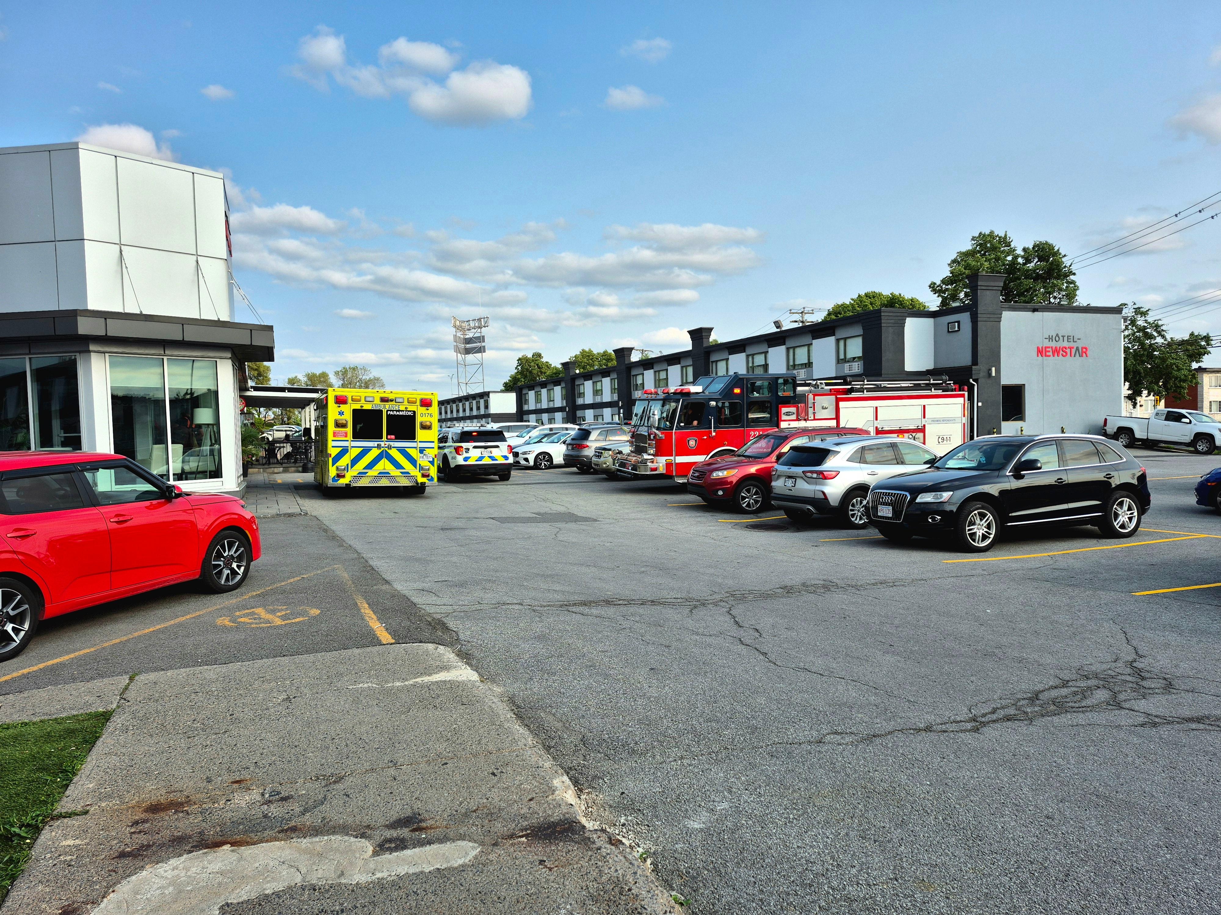 Constant Fire trucks & ambulances. Dingy parking lot.