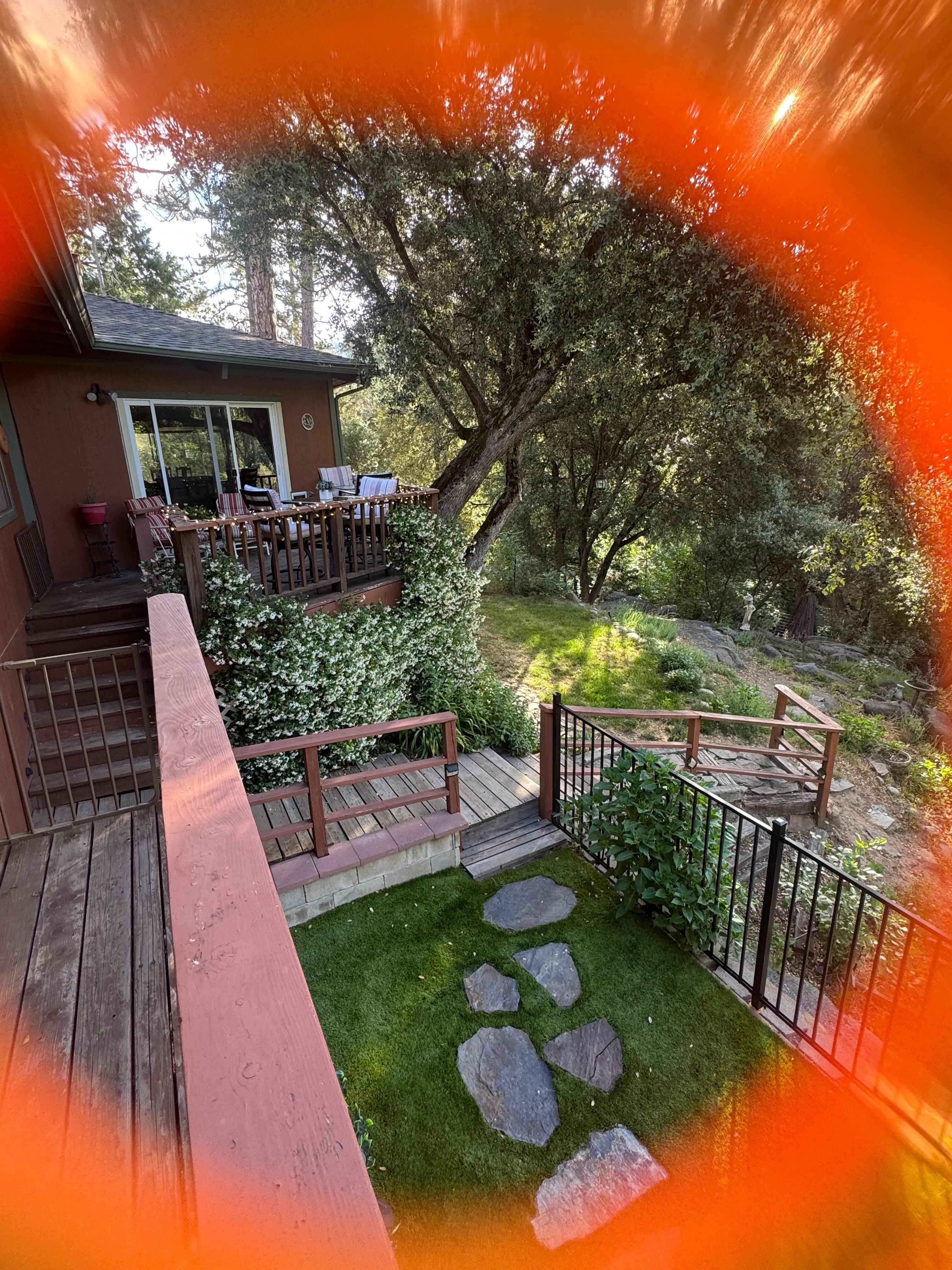 View of house and great yard, stone steps lead to the hot tub-soo nice!