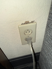 Loose outlet cover full of lint waiting to catch fire