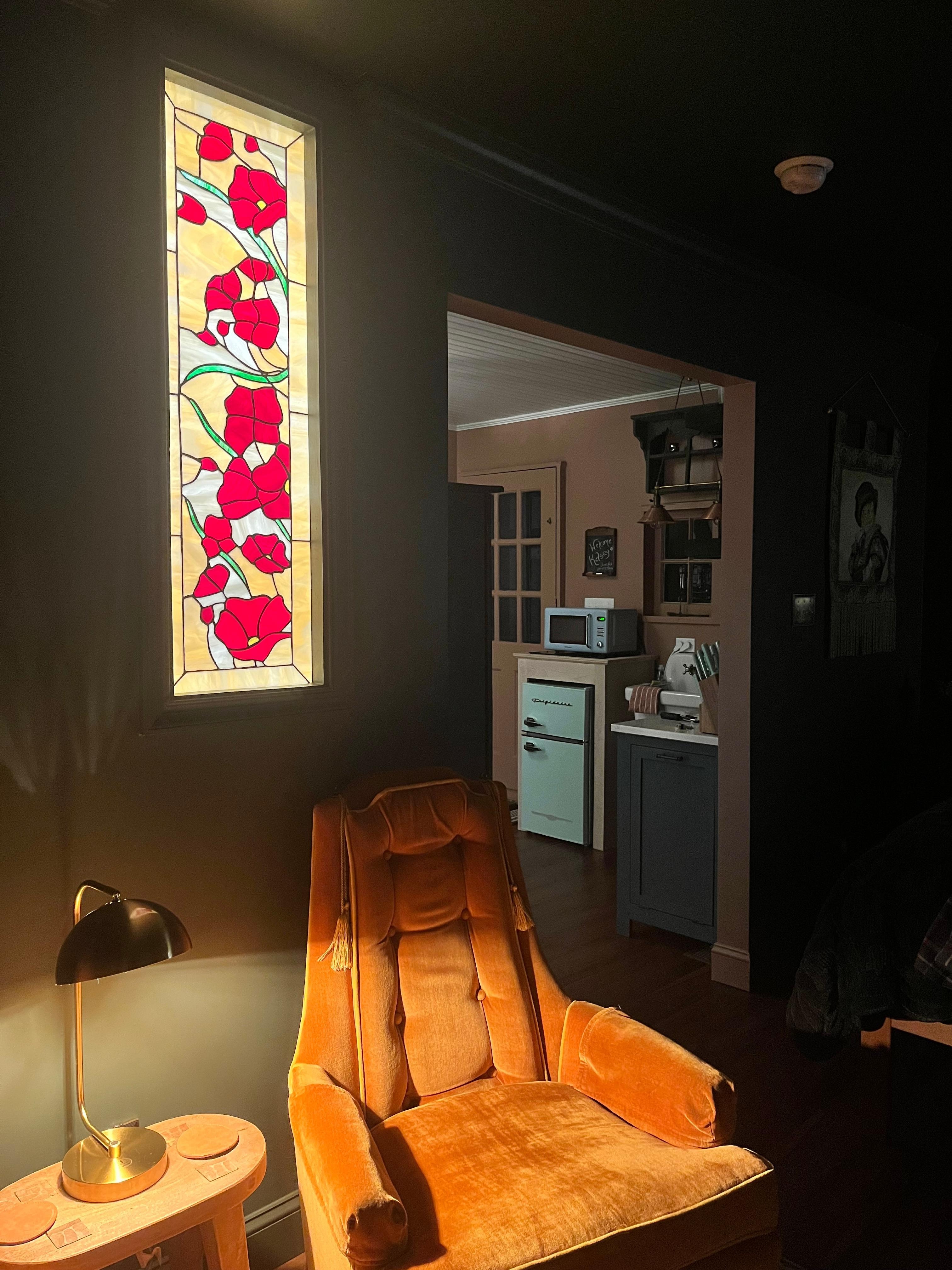 This space has so much character, including a stunning interior stained glass window, which can be viewed from both sides. 