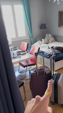 Living/ dining room with bed. There is NO common area.