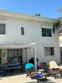 Rotten patio cover and trim falling off windiw upstairs
