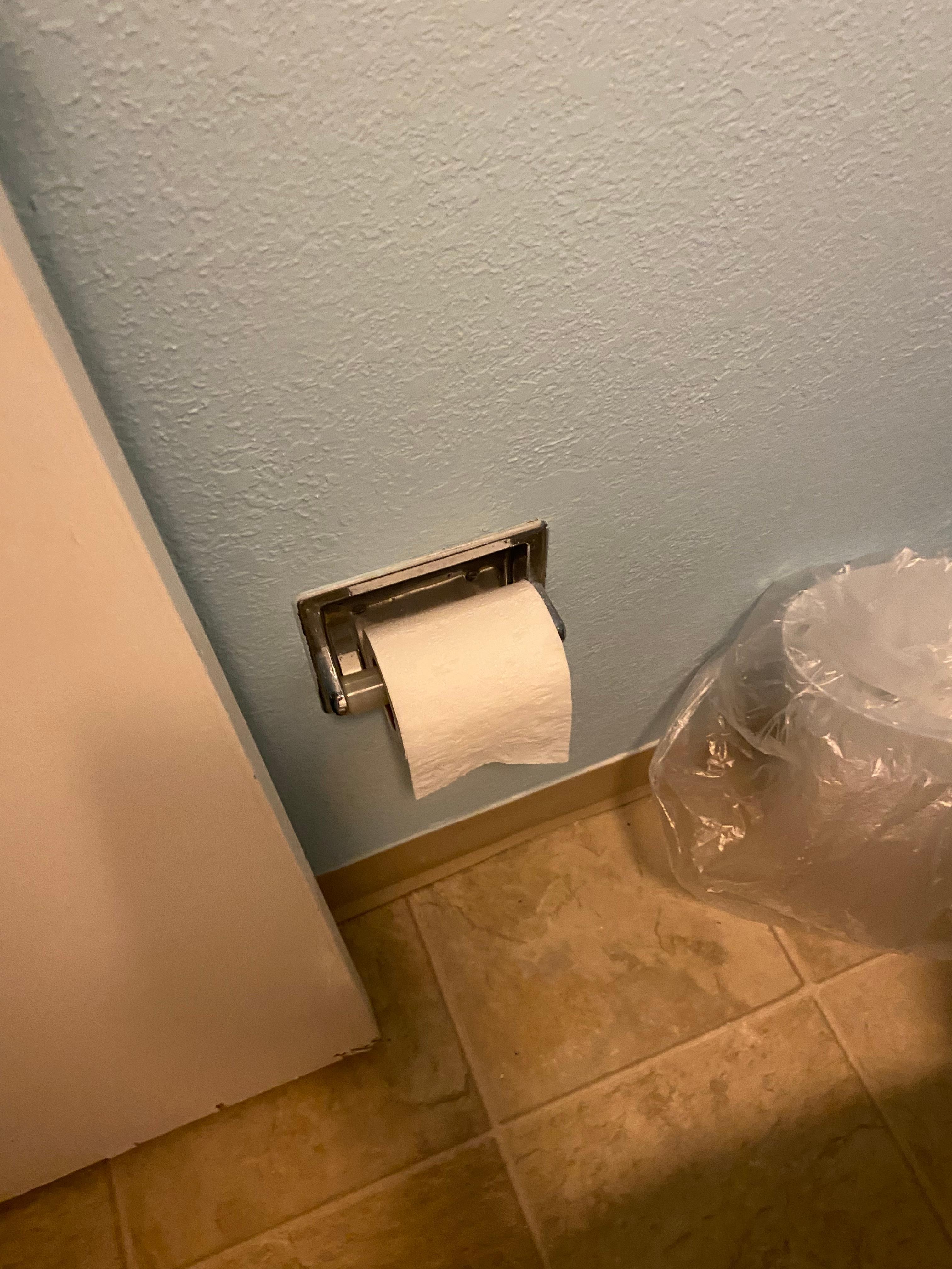 Half used toilet paper roll