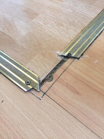 Sharp floor bar in kitchen area needs serious attention.