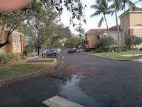 Trash can at opposite end of both buildings