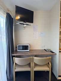 Desk & 2 comfortable chairs + microwave & TV