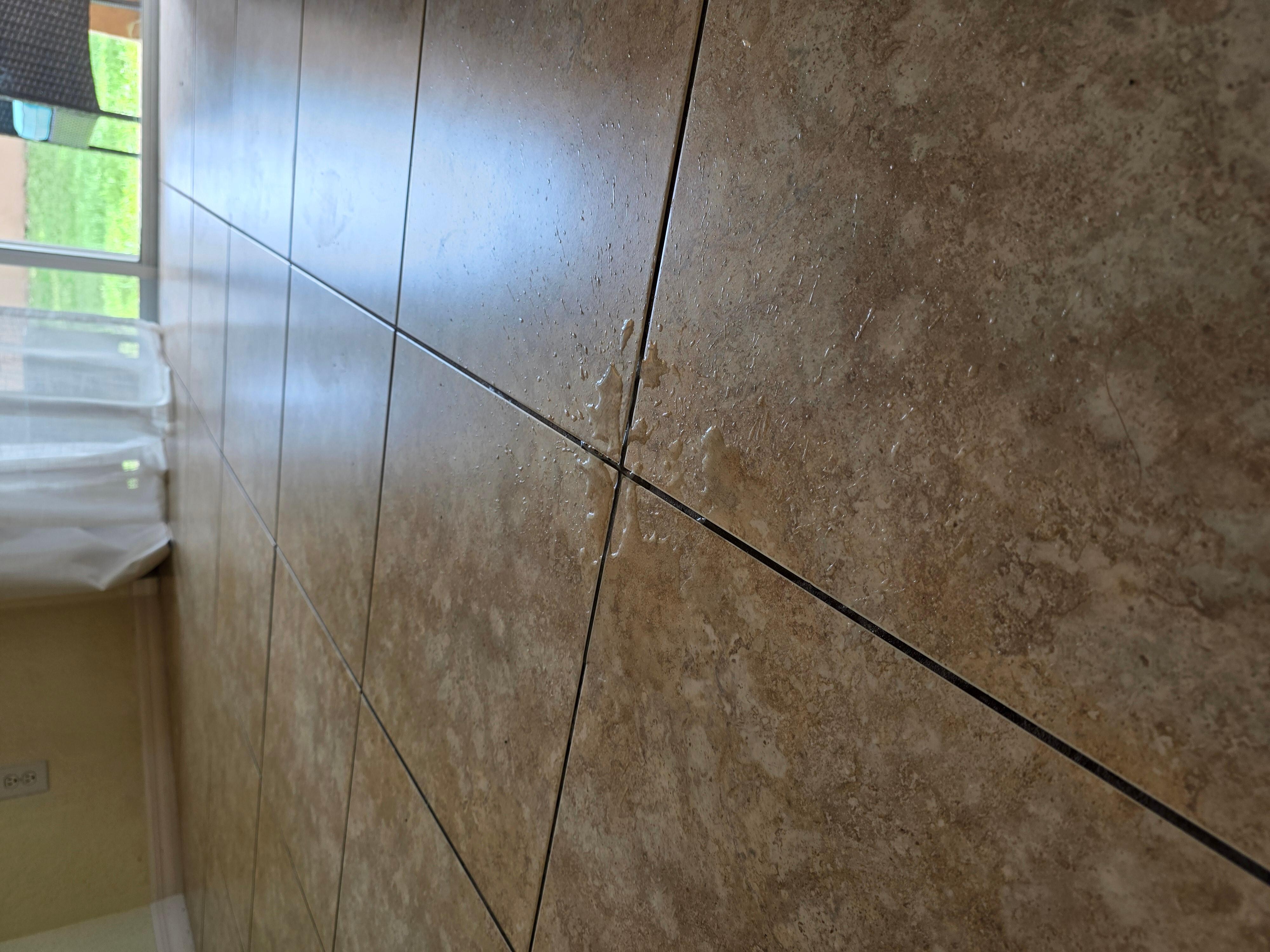 Puddle of water in living room from ceiling