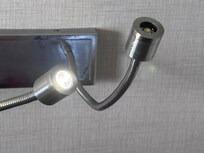 Broken light fixture for reading light next to one bed that was broken and did not work
