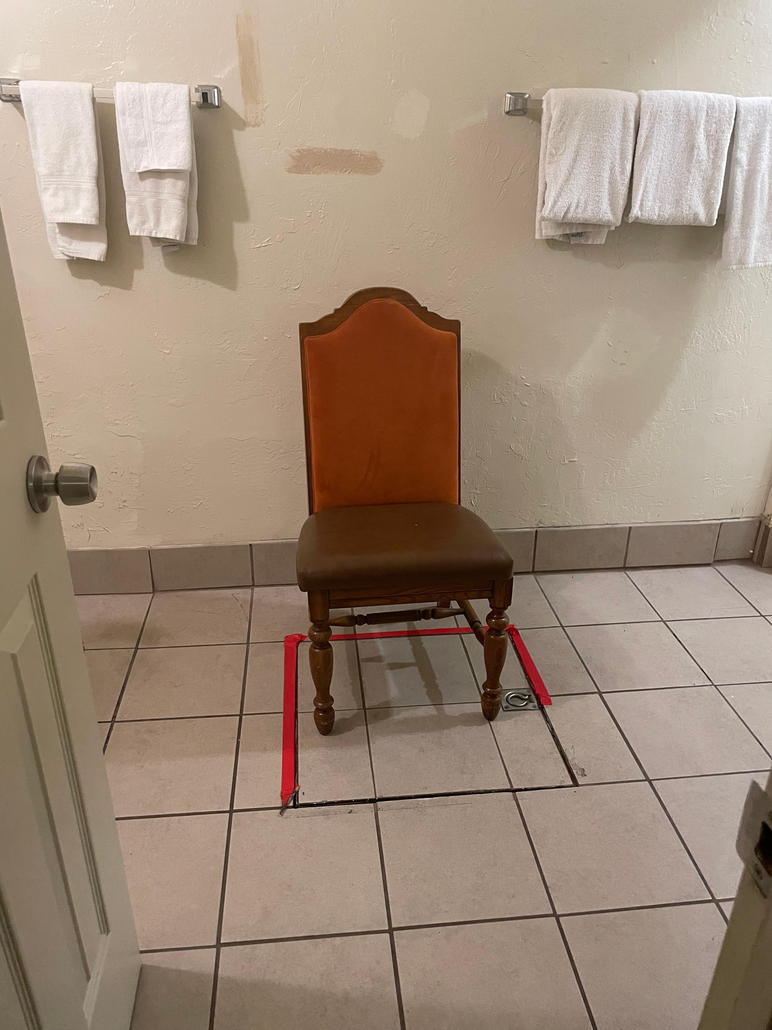 Chair “protecting” the basement trap door