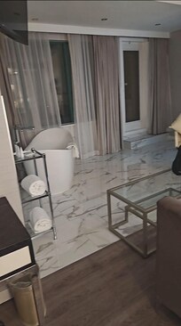 Beautiful time surrounded tub .