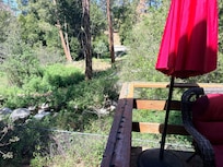 View of the creek from the deck. (Easy creek trail access from back yard gate)