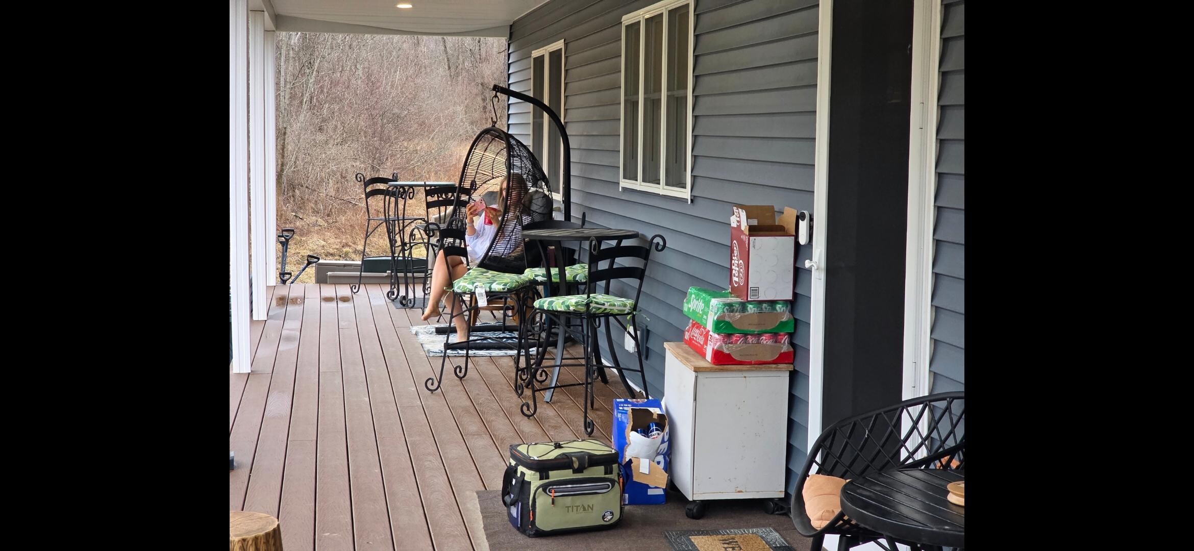 Our daughter enjoying the swing on the back deck
