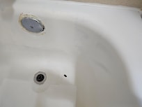 Ceramic coating peeled off in bathtub.