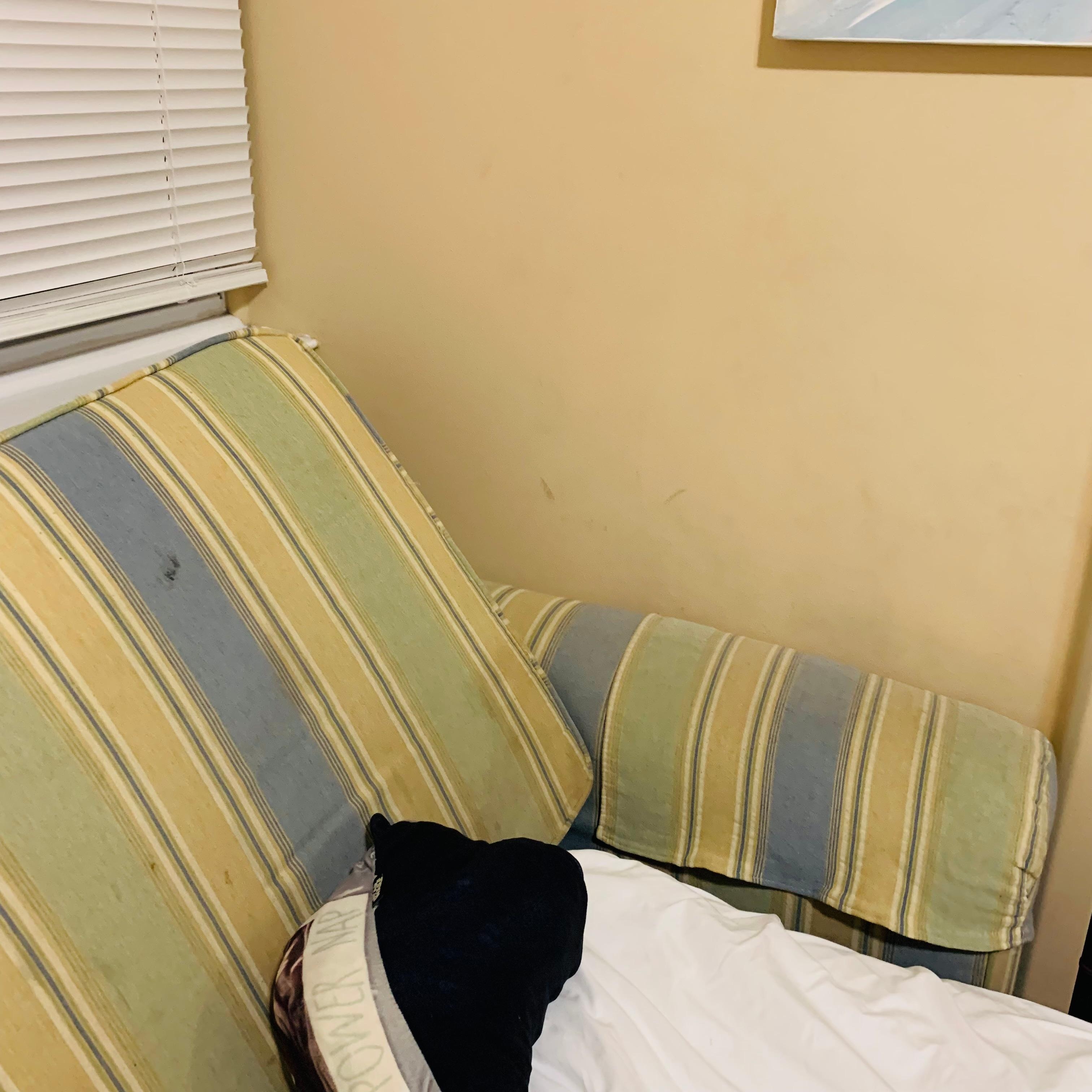 Walls and stained cushions