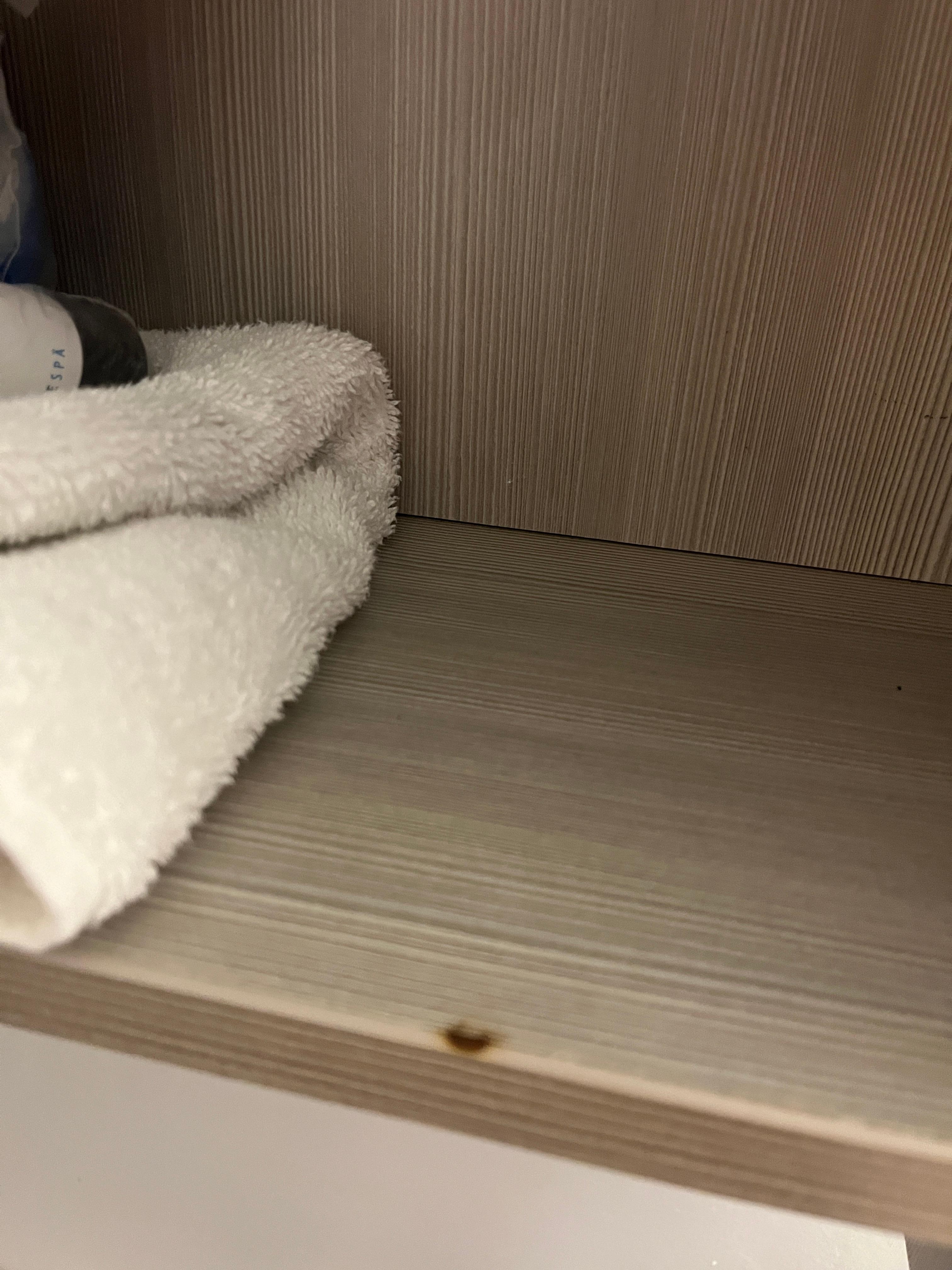 Cigarette burn on bathroom cabinet