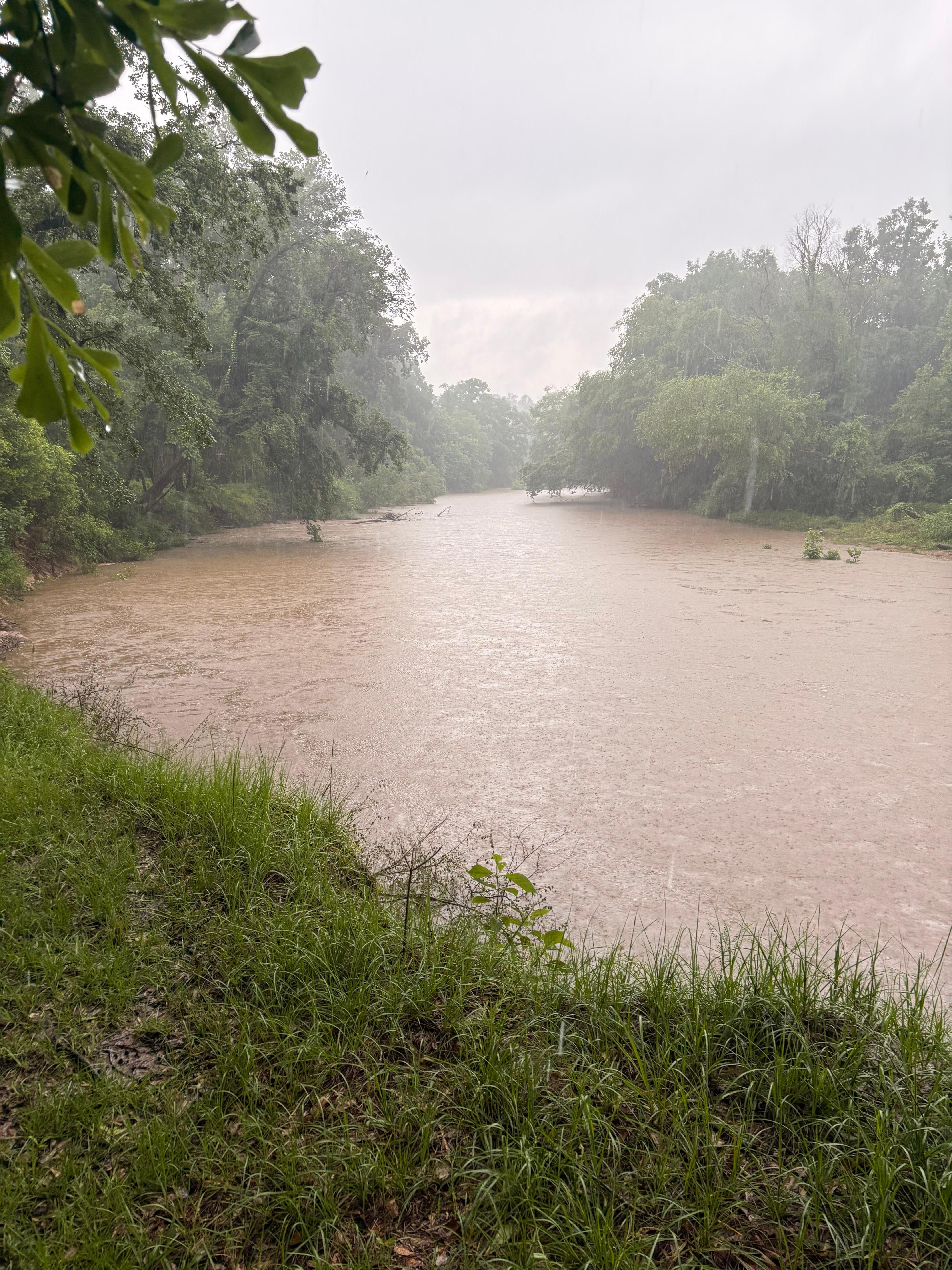 River swollen due to inclement weather.