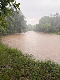 River swollen due to inclement weather.