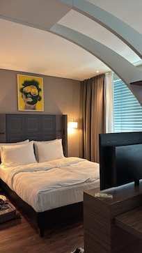 One side of the room with the double bed. You can see the divider that separated it from the other side.