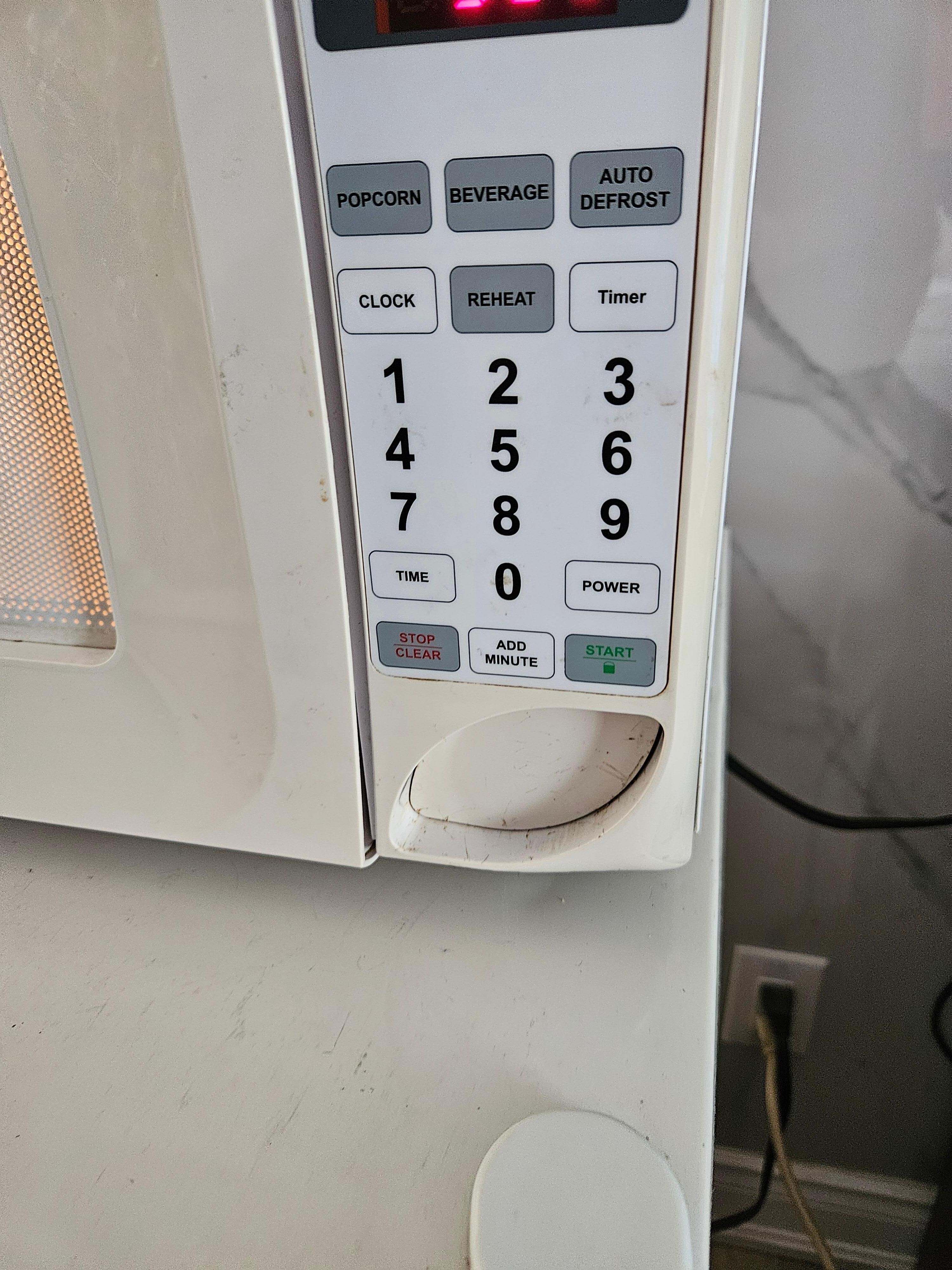 Tried to open the microwave and then it stuck like that 