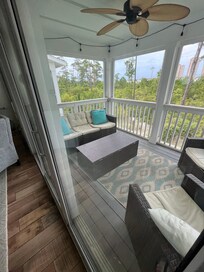 Sweet screened in porch on second floor.