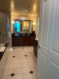 Huge bathroom with sitting area for makeup.