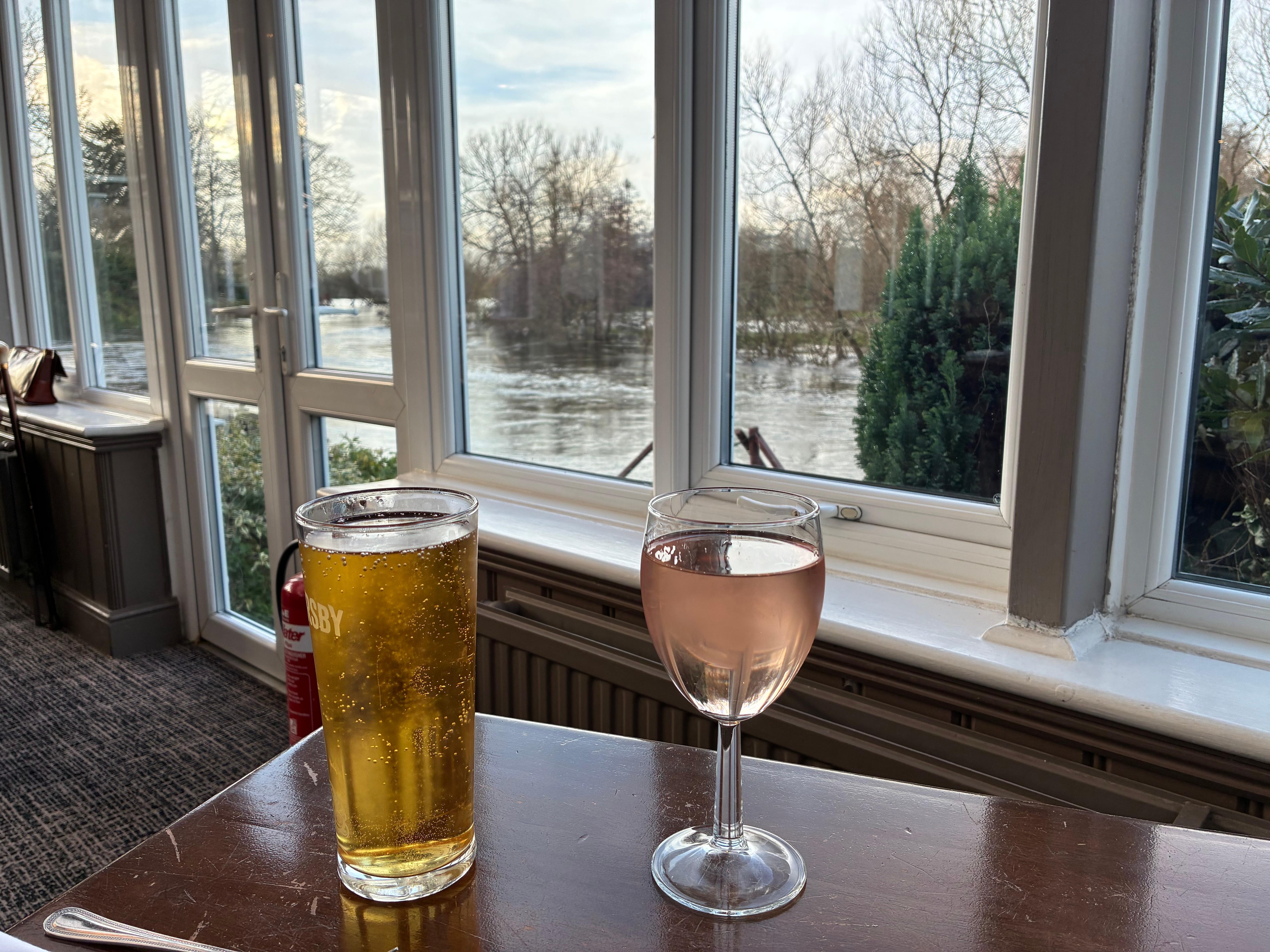 Drinks in the bar overlooking the (very high) river….