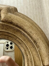 Mirror with mold around the rim