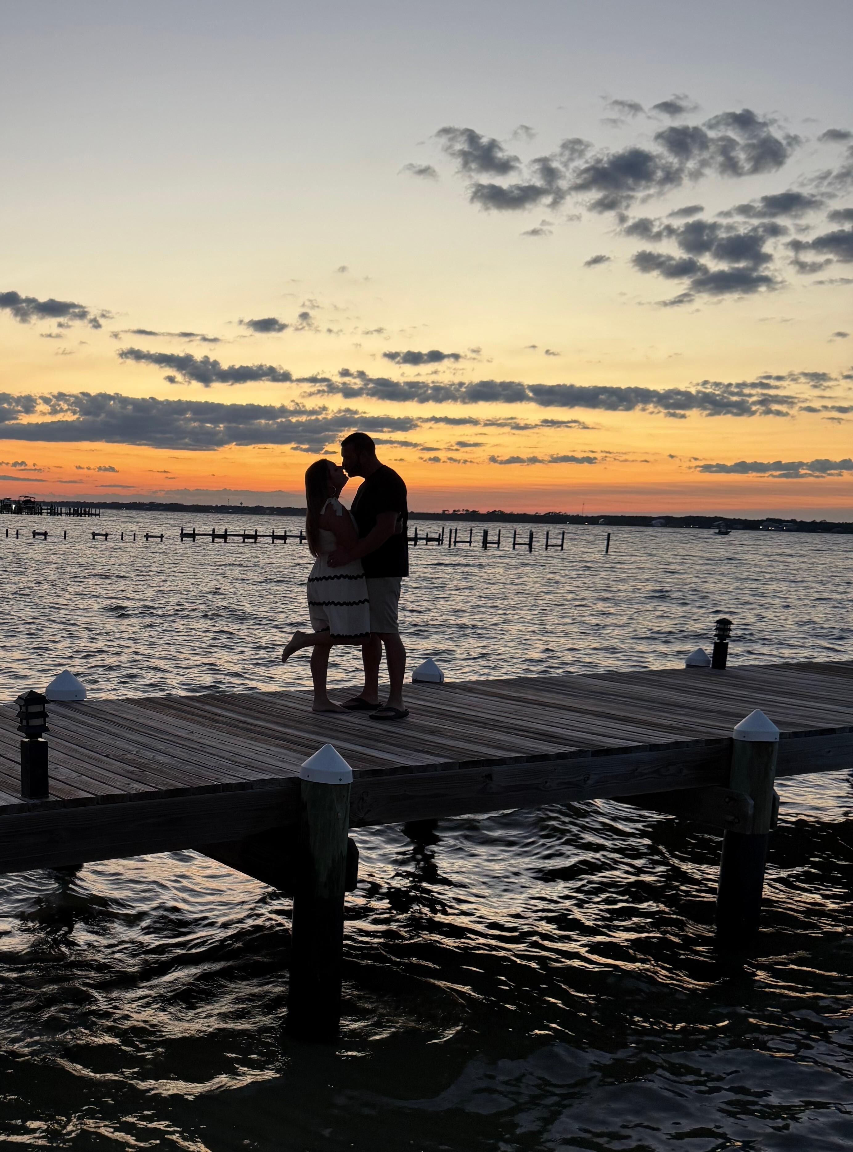 Fishing or kissing pier with a beautiful sunset.
