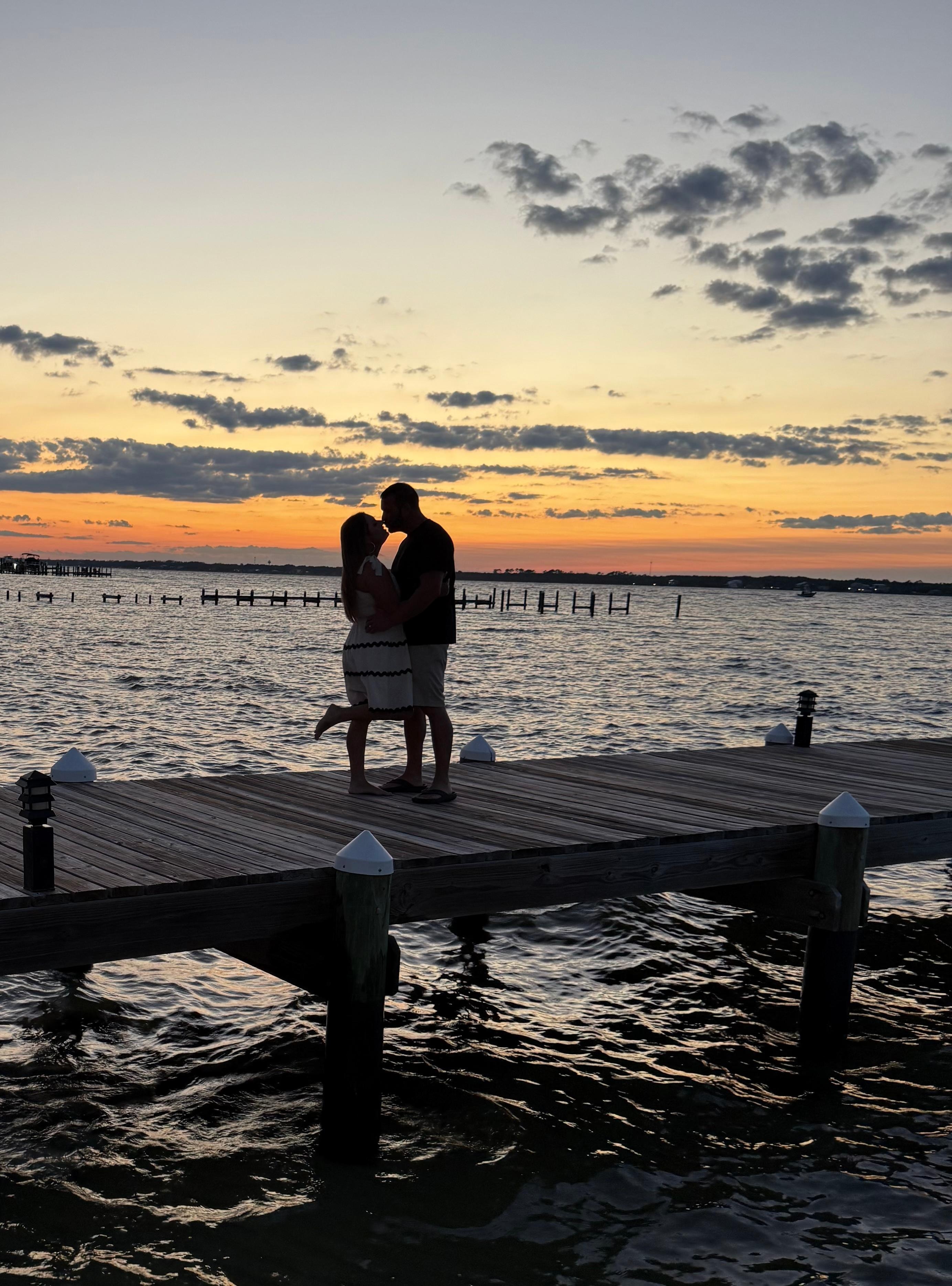 Fishing or kissing pier with a beautiful sunset.