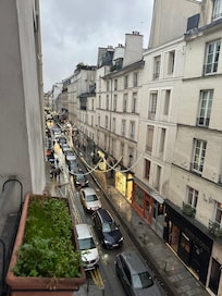 View out of the window down the street below.