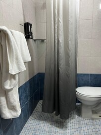 Shower was 2’ x 2’ area with curtain touching the toilet. Not at all like photo shown.