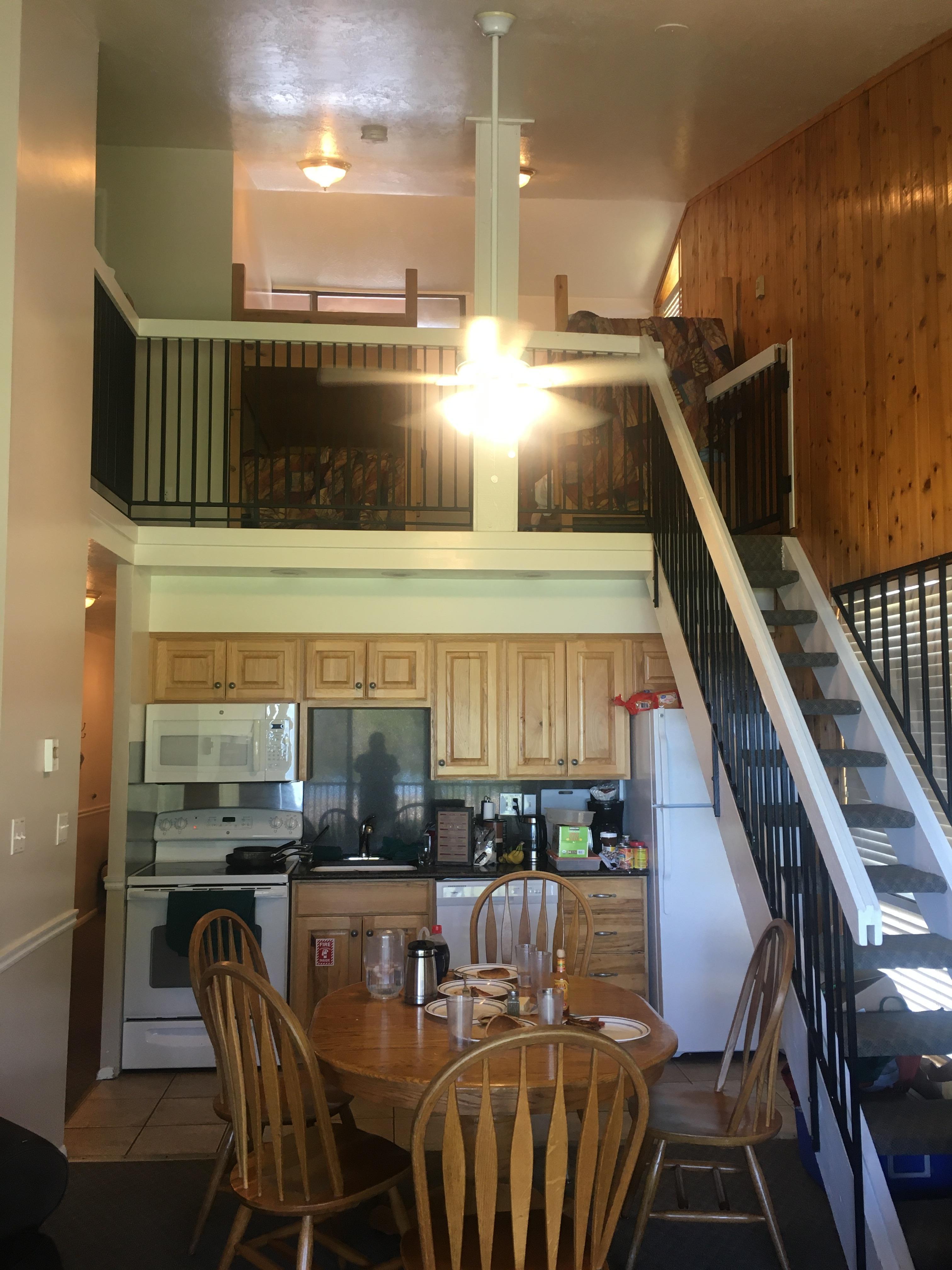 Main living area and loft with beds and 2nd bathroom. The bedroom with 2 queen beds, plus bathroom, along with the door, are down the hall to the left of the stove.