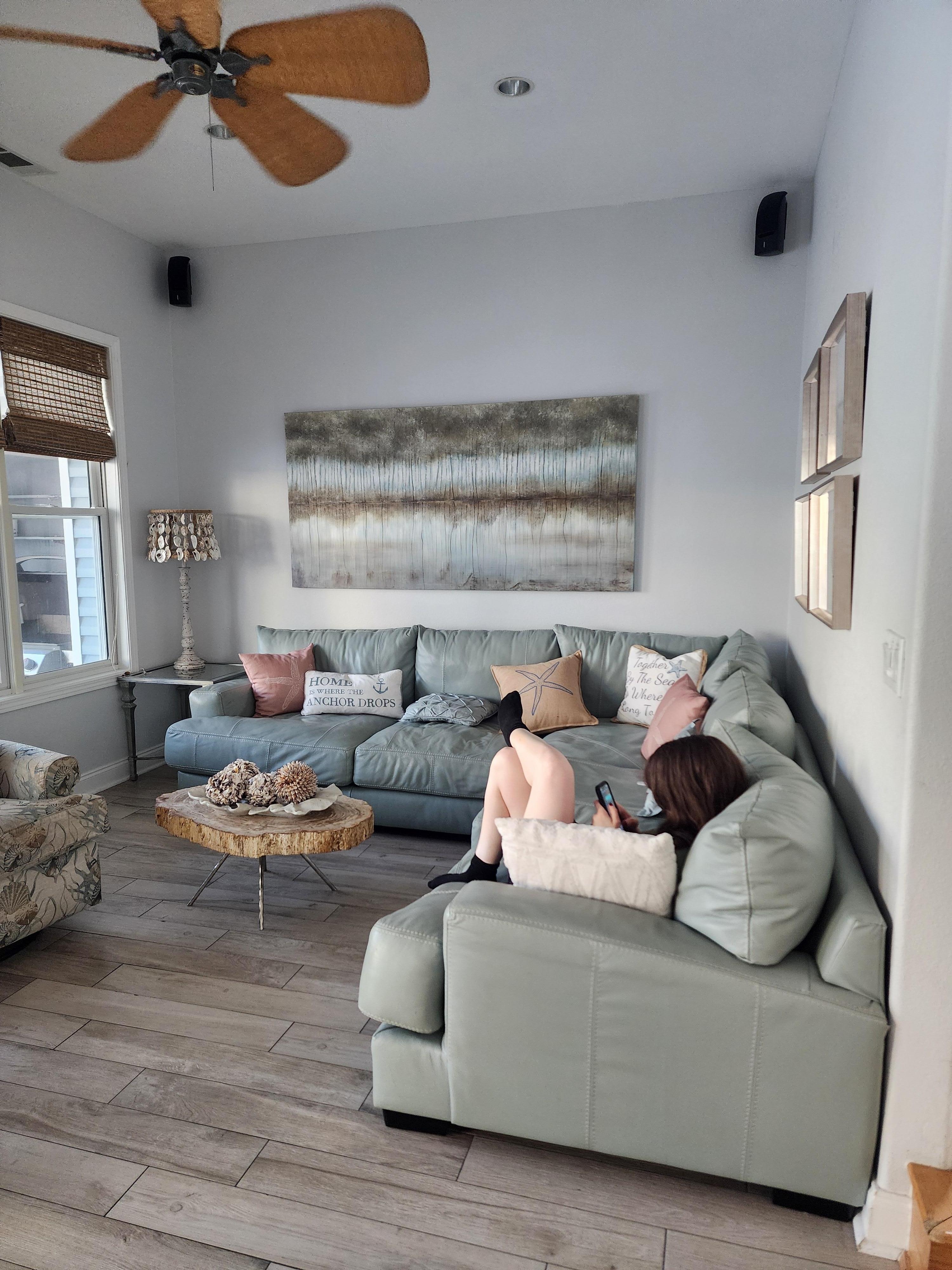 Nice size leather couch and 2 swivel chairs to accommodate everyone for family movie night!