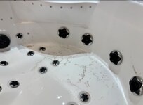 Remains of sediment in jacuzzi bath - unused by us due to the smell from the jets when turned on
