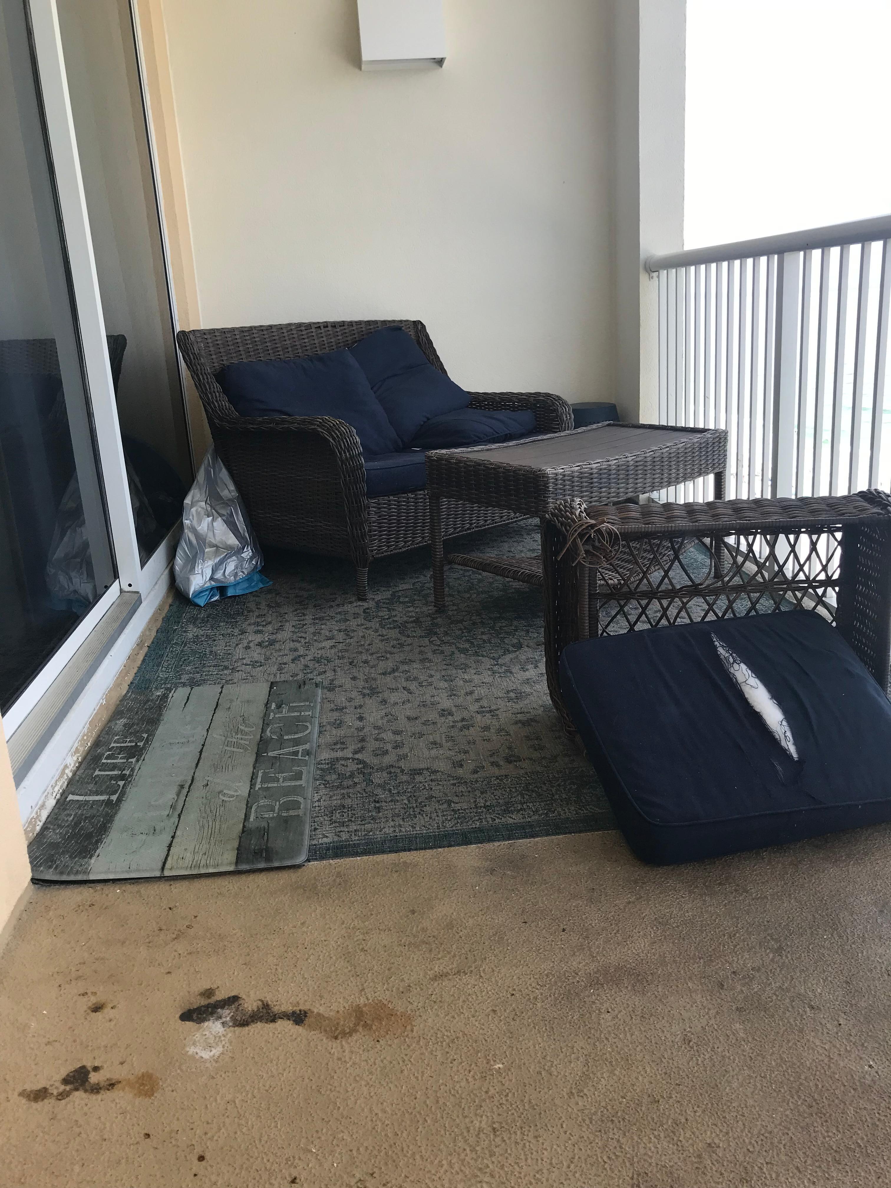Balcony filthy; furniture broken; 2 piles of s**t