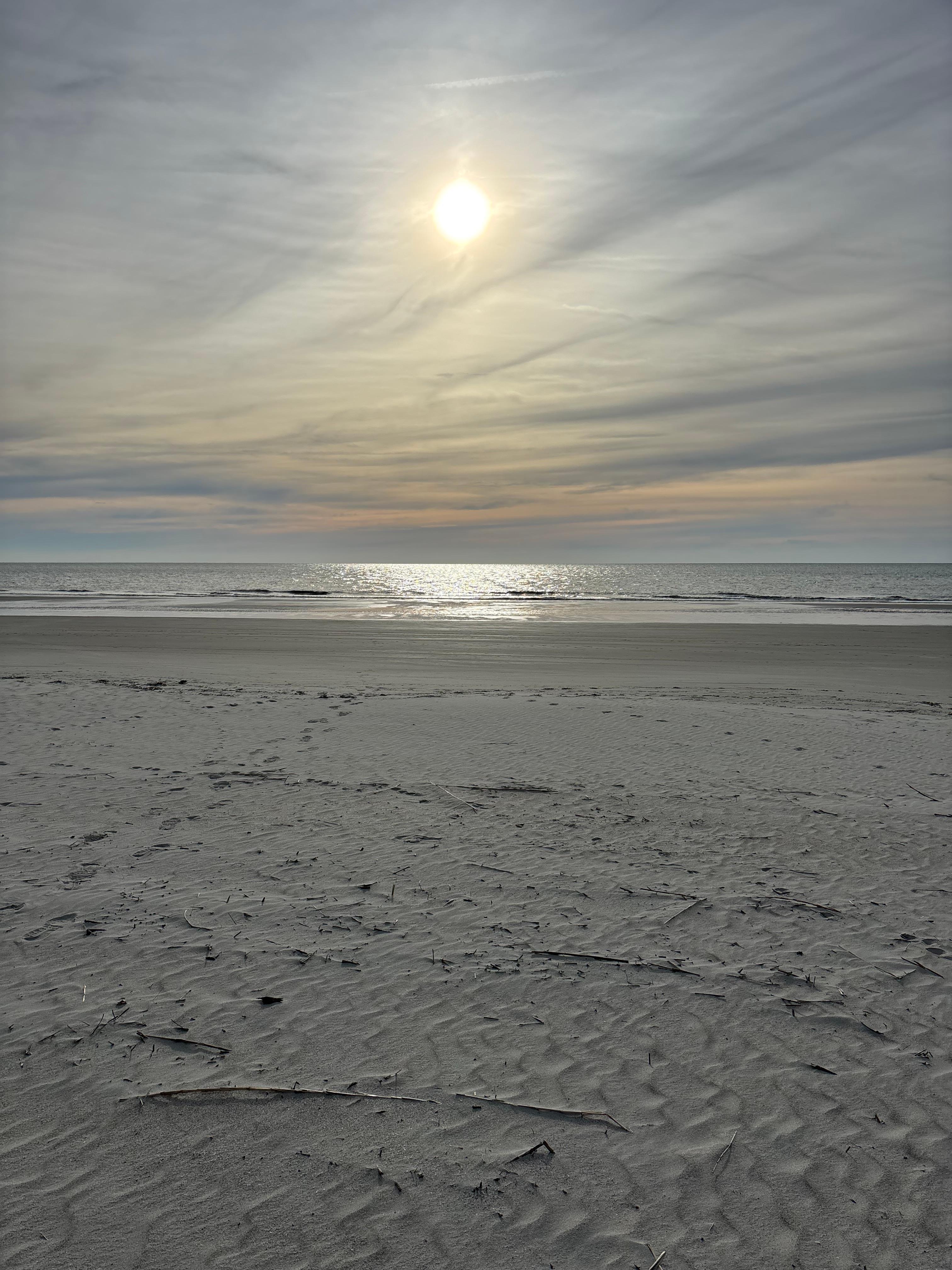 Beach walk in front of building. 