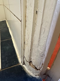 Bathroom doorway. Dirty & moldy