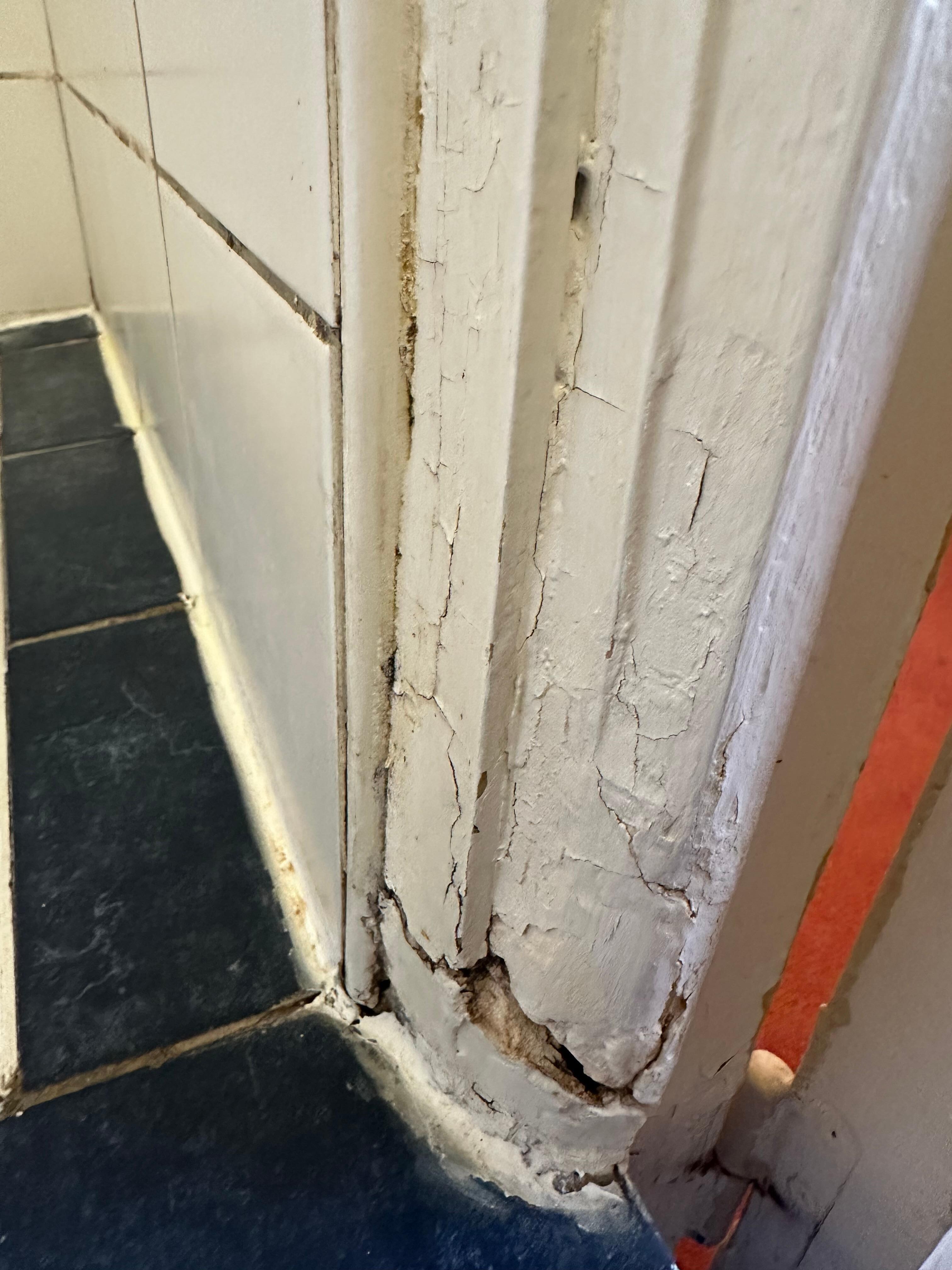 Bathroom doorway. Dirty & moldy