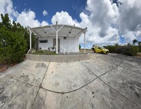 Side of unit. Open lot beside unit