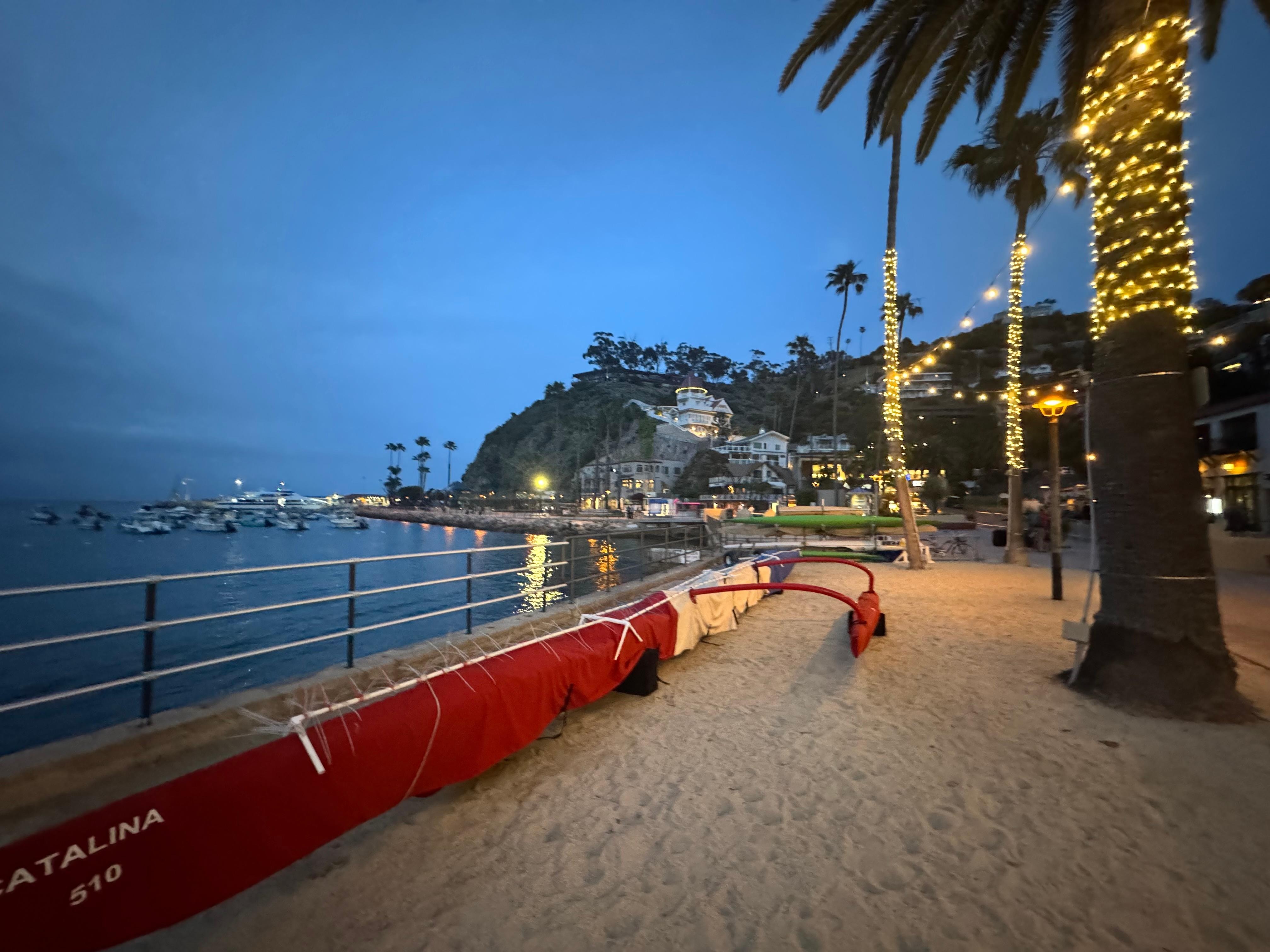 This is the beach at the end of the block all lit up at night.