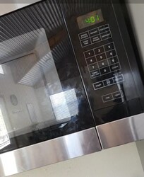 Grease and handprints all over microwave