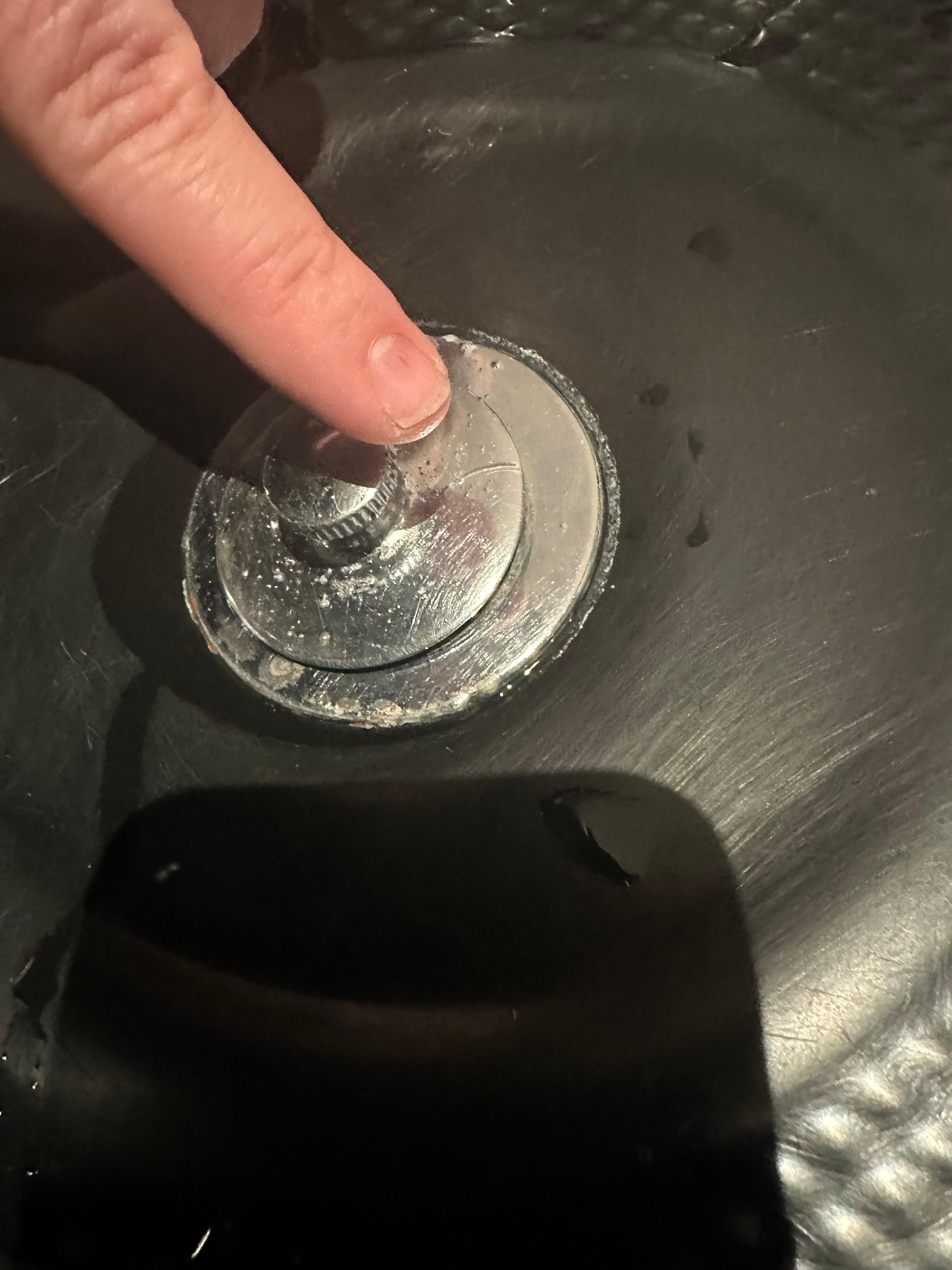 Master bathroom jacuzzi tub plunger crack