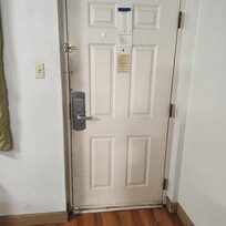 Filthy door that would be very easy to kick in. Terribly insecure and unsafe.