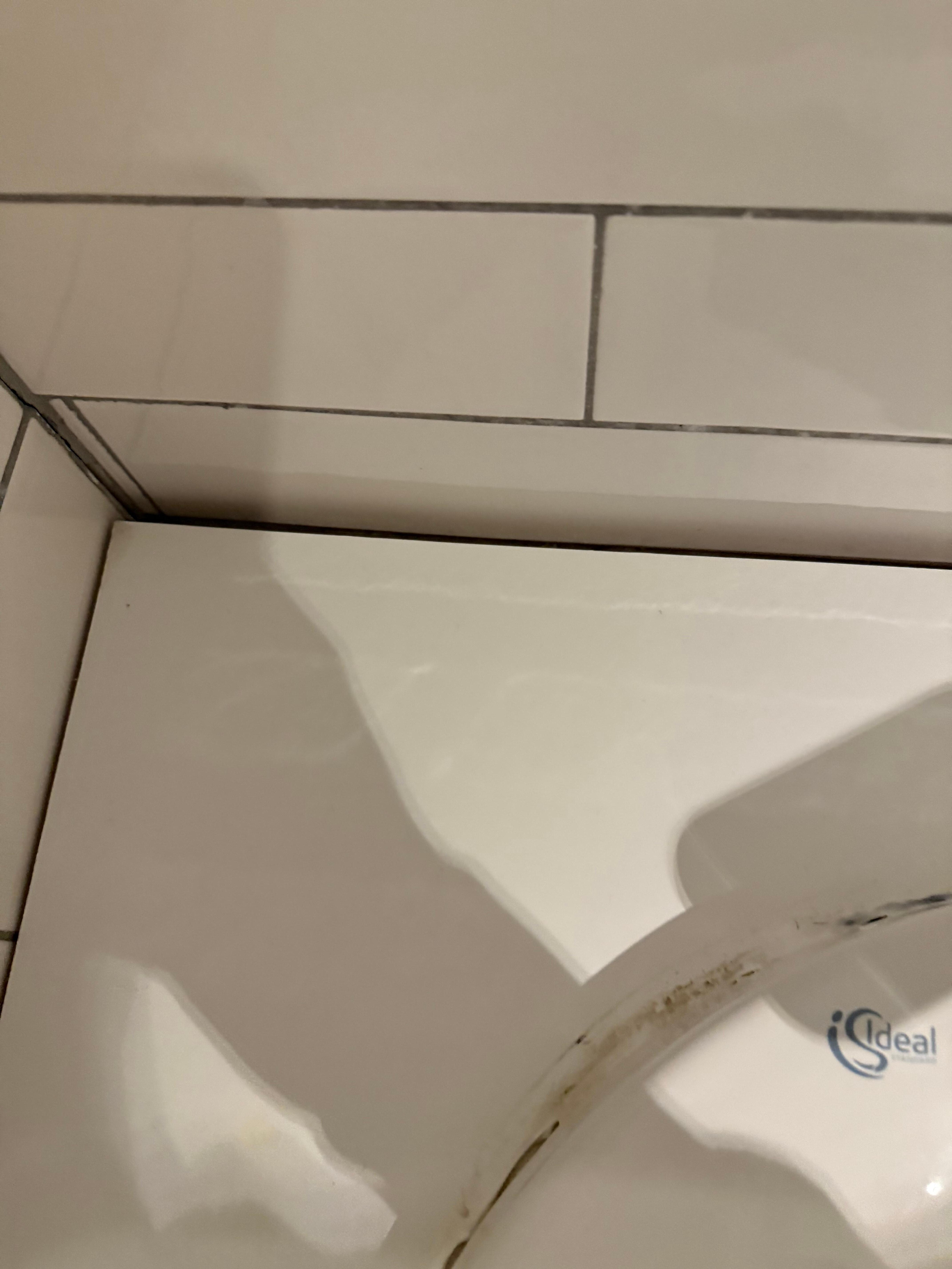 Bathroom sink unit hanging off the wall. 