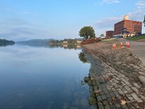 River with hotel in background to the right